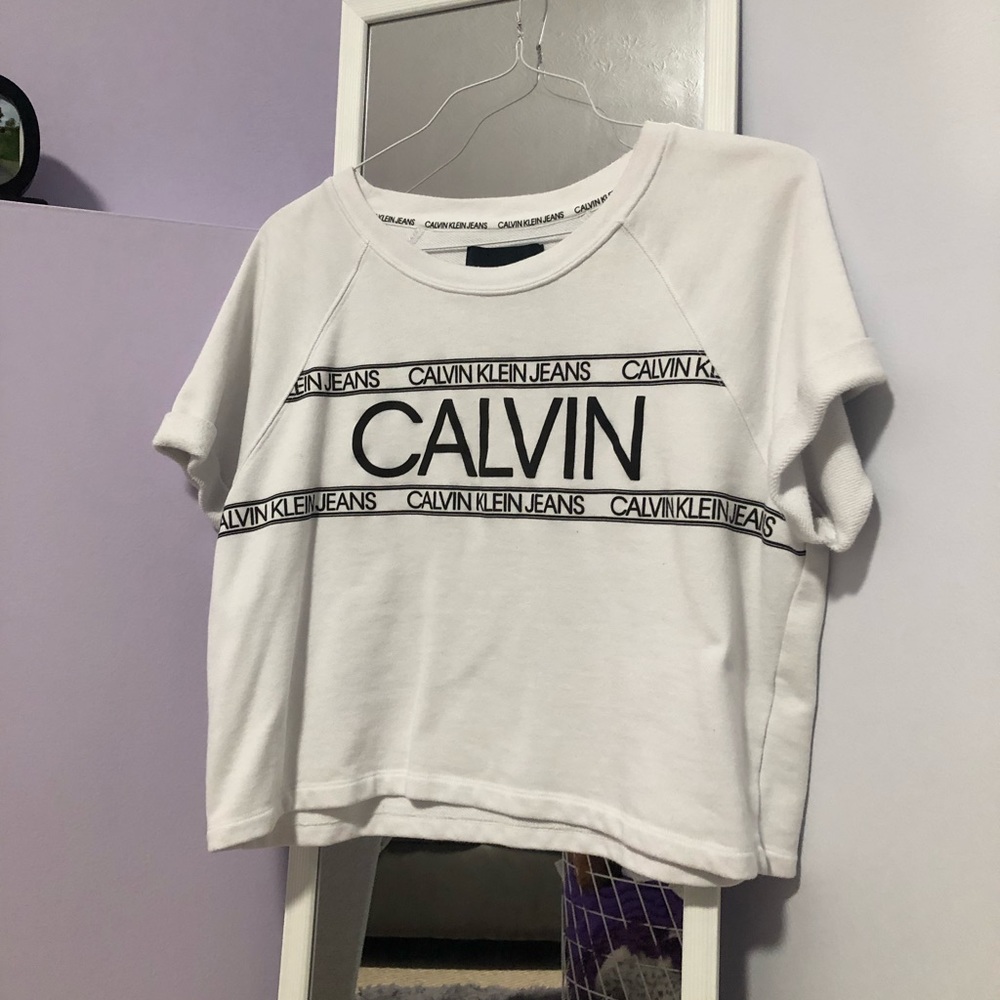 Calvin Klein white logo crop top. size large, relaxed look and feel. NEVER WORN